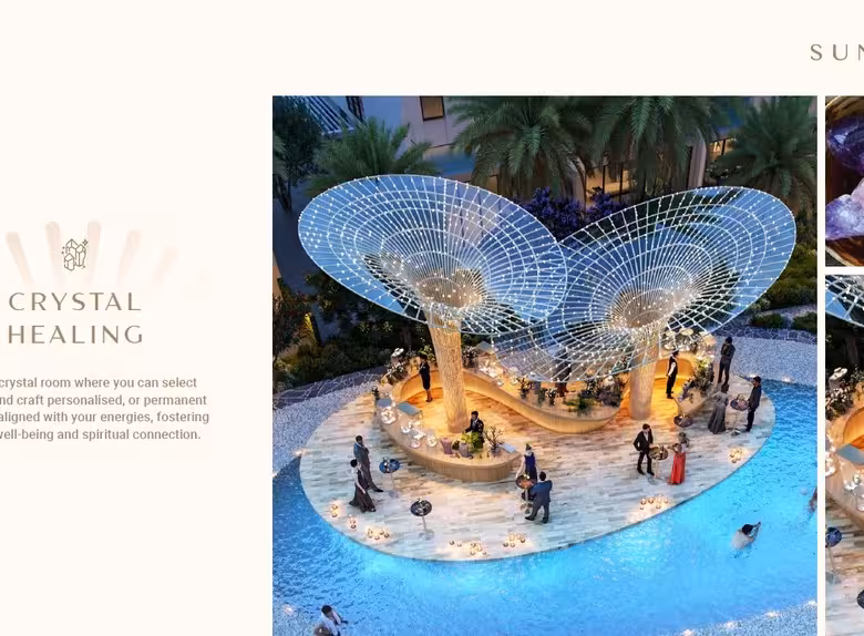 Resort pool with ornate crystal-inspired sculptures and palm trees.