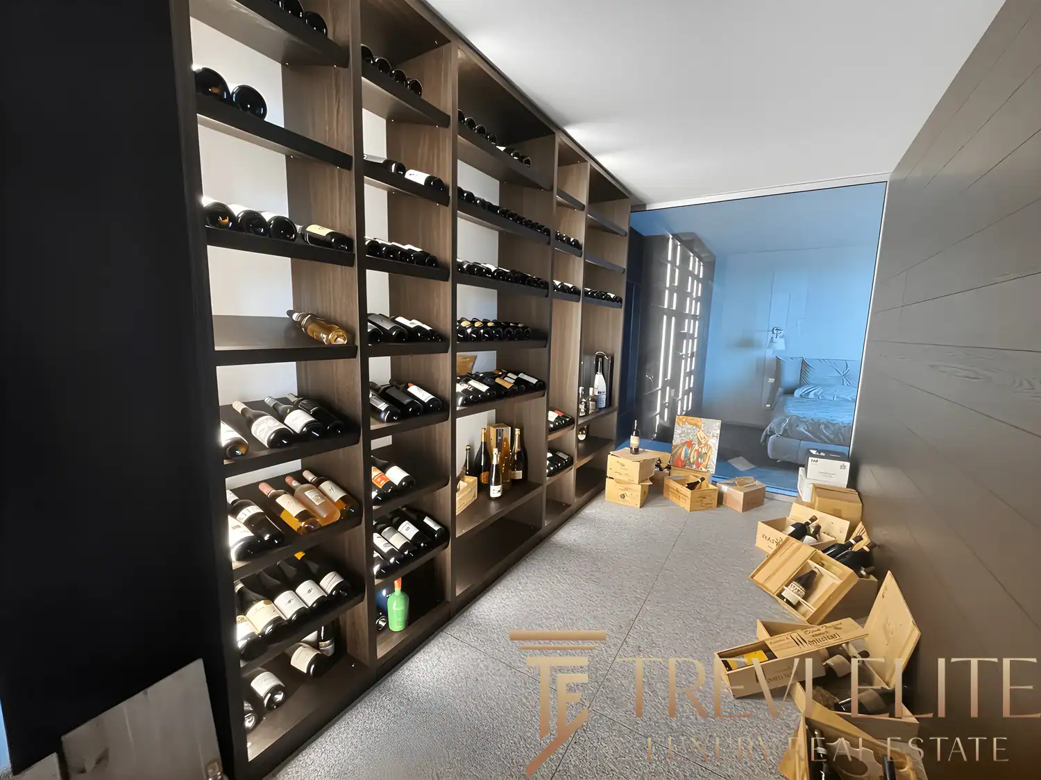 Custom wine cellar with floor-to-ceiling wooden racks and ambient lighting.