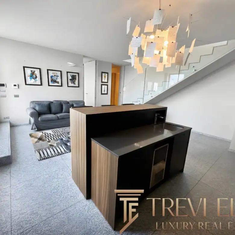 View of the stairs and a minimalist wooden room divider.