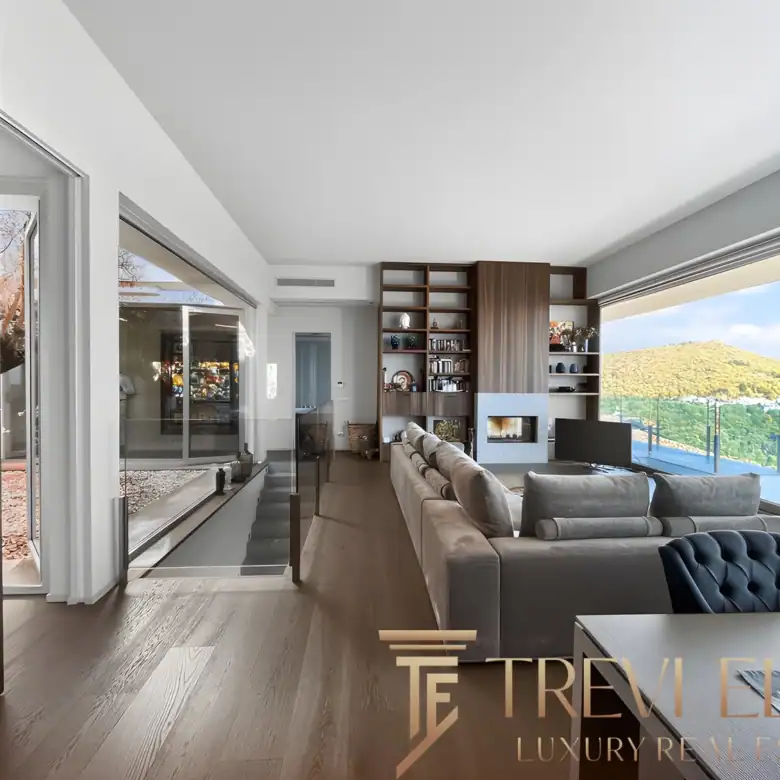 Open-plan kitchen with a large island and lake-view windows.