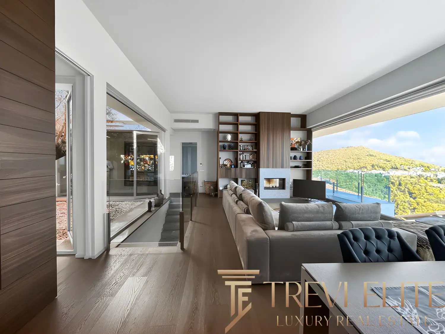 Open-plan kitchen with a large island and lake-view windows.